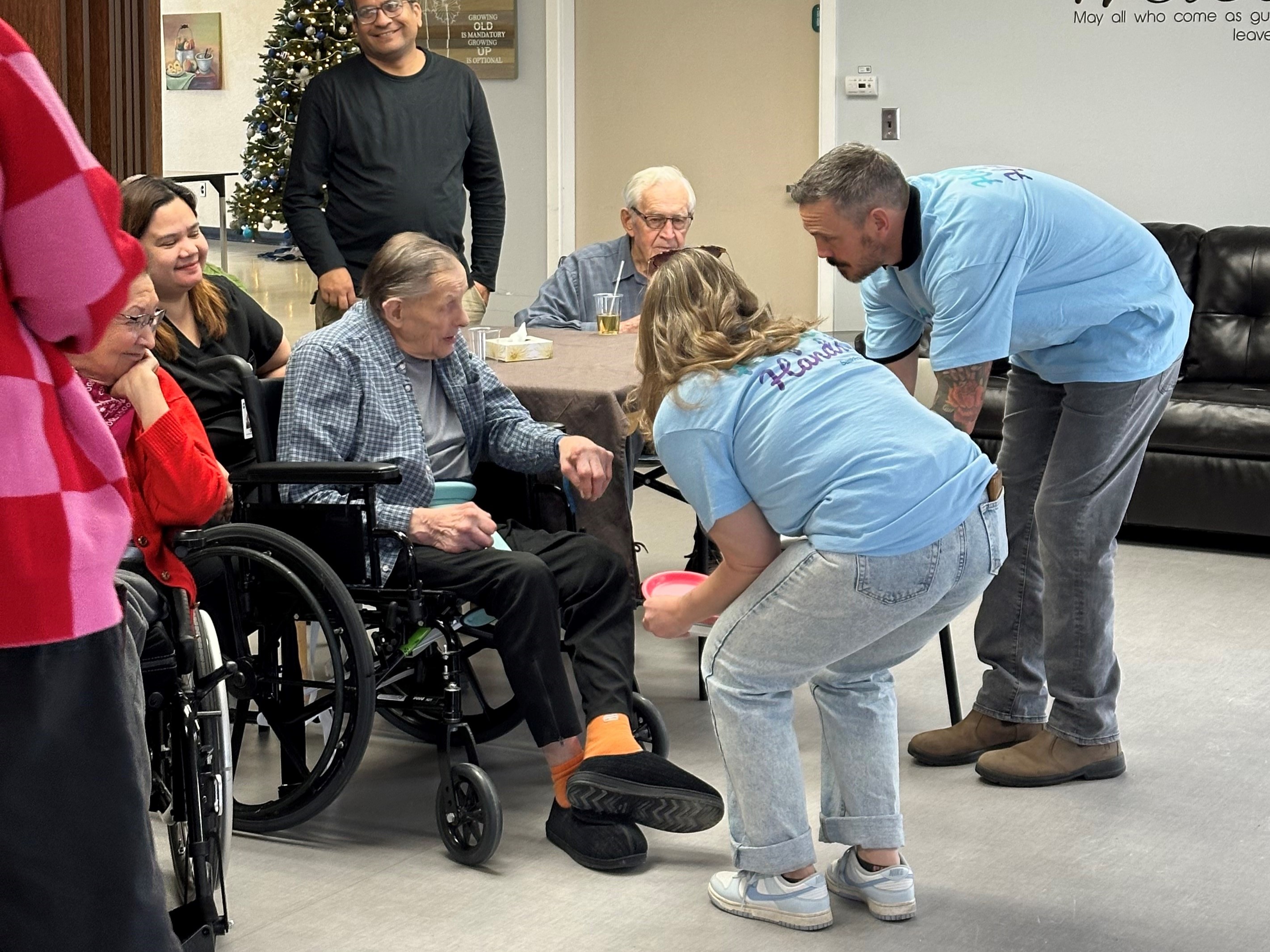 Employees speaking with a senior