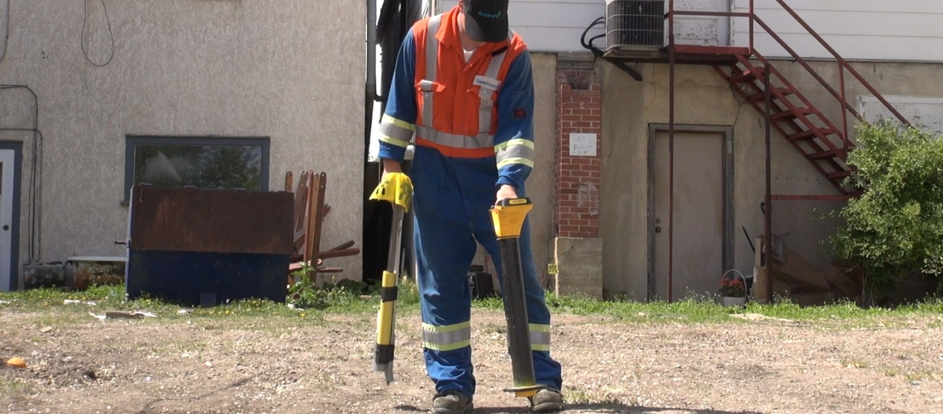 SaskEnergy service technician performing a line locate. 