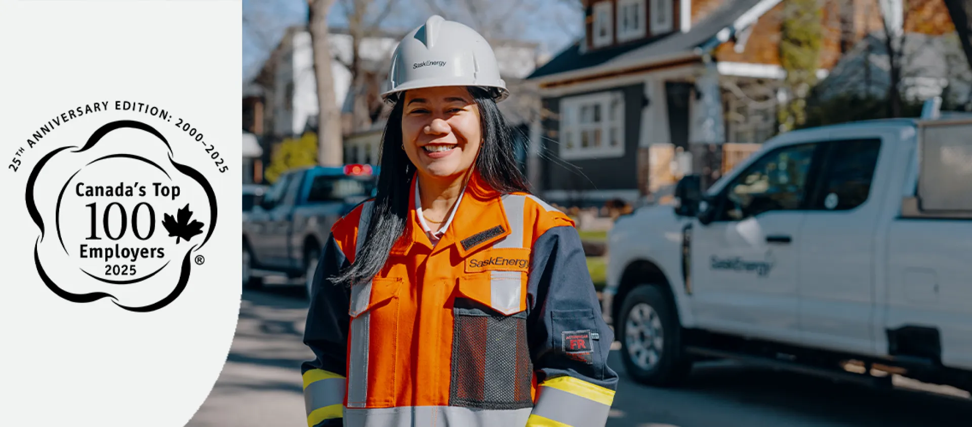 A woman with long dark hair in orange and blue safety gear and a grey hard hat stands in front of a SaskEnergy truck. A Canada's top 100 employers logo is on the left of the image. 