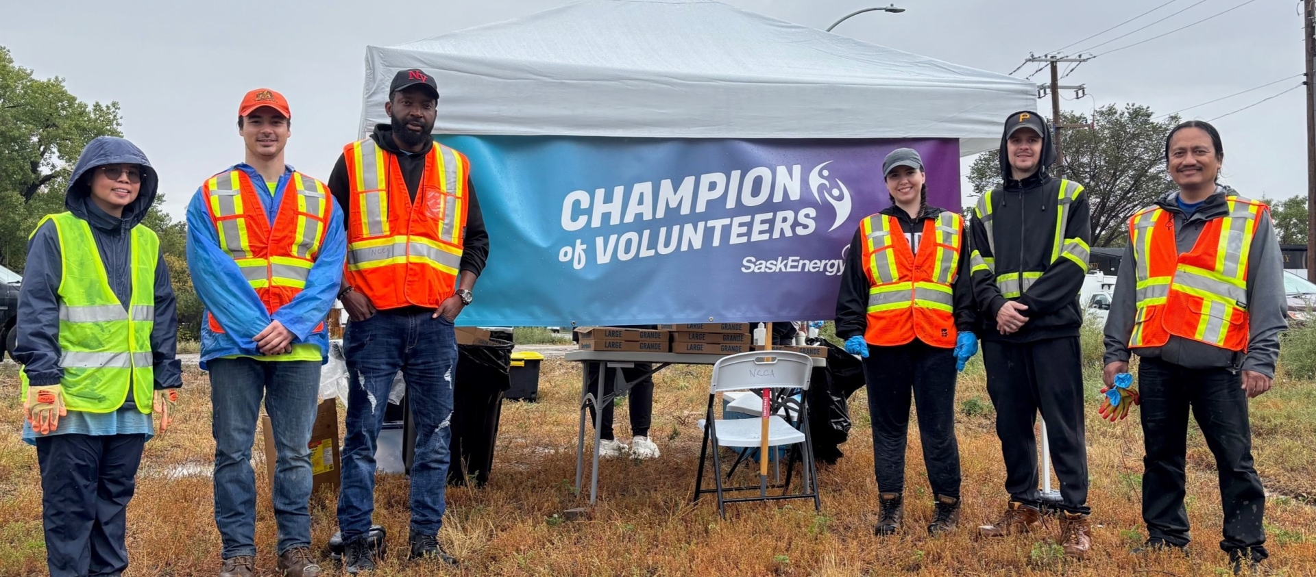 People posing for a photo in high-viz gear