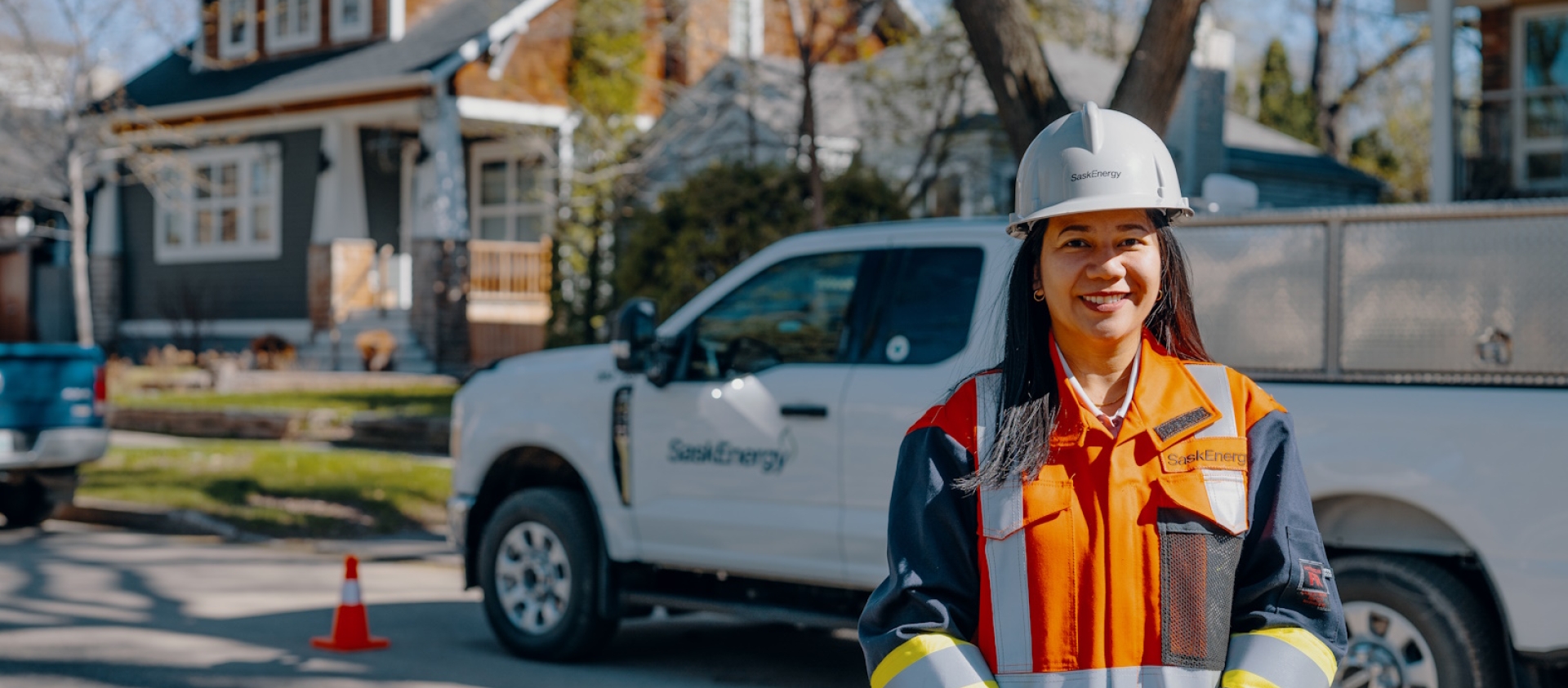Service Technician SaskEnergy worker poses in front of SaskEnergy truck