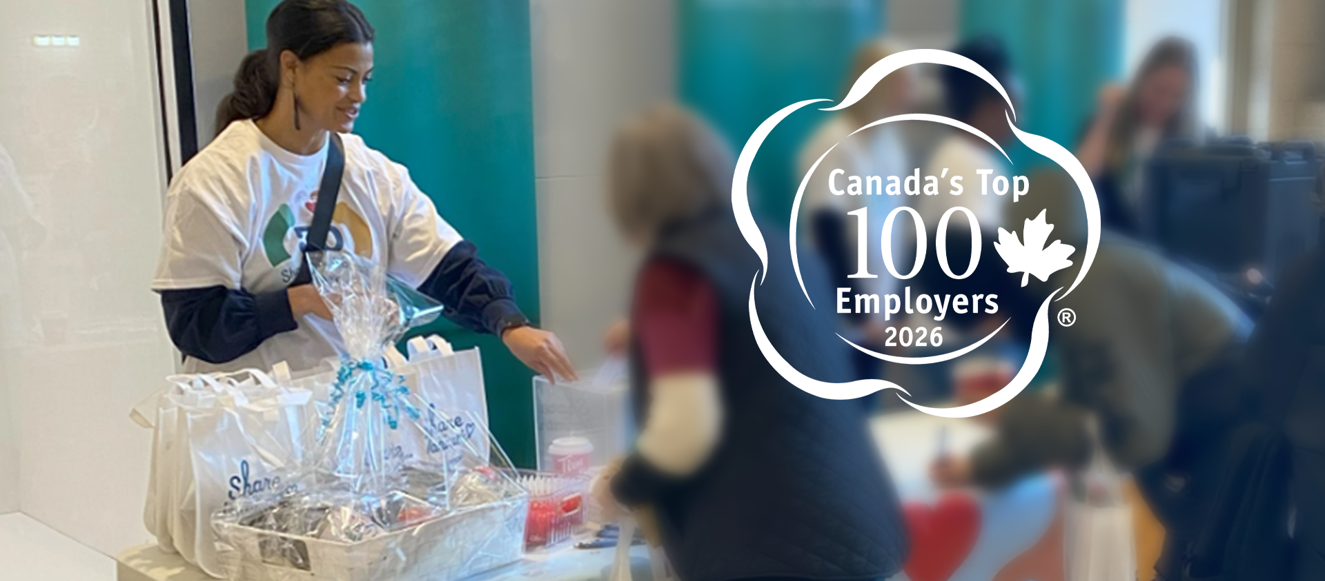 SaskEnergy employee hands out Share the Warmth gift bags.