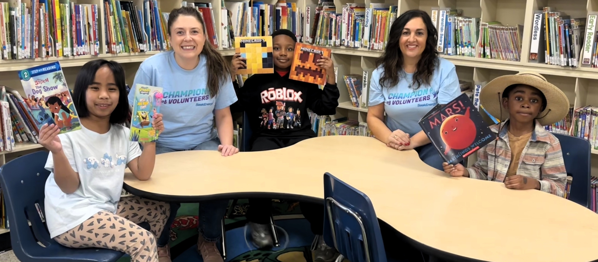People smiling in a library