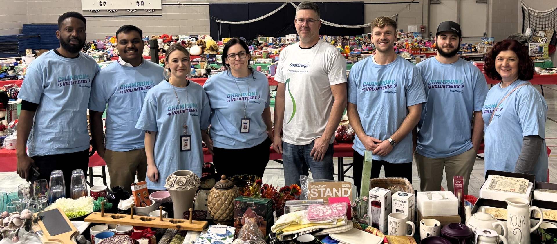Group photo in front of gifts