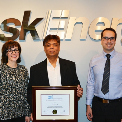 saskenergy employees stand with CGA award