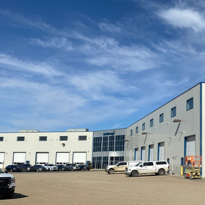 A wide-shot view of the Regina Service Centre building in fall, with blue sky above.