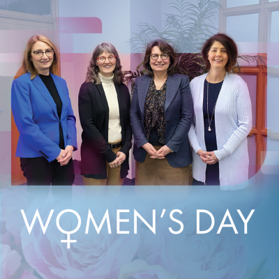 SaskEnergy's four women executives stand together in a row, smiling
