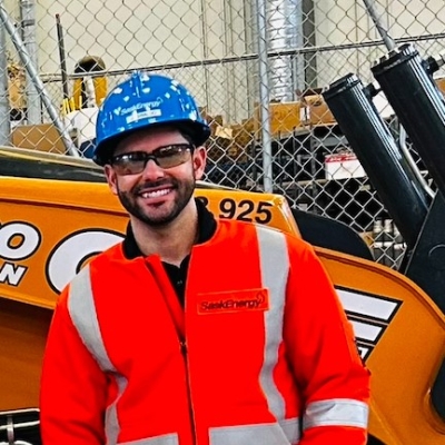 A person in a high visibility jacket and a hard hat