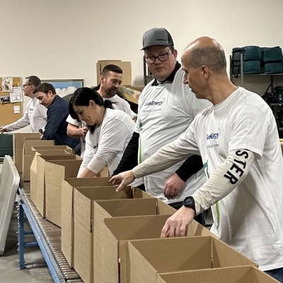 People put together boxes on an assembly line