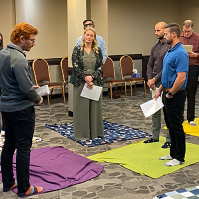 A group taking part in a blanket exercise