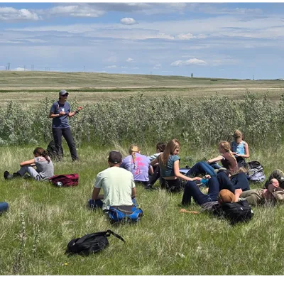 Group sitting in grass.