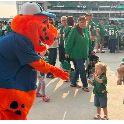 Mascot greeting child