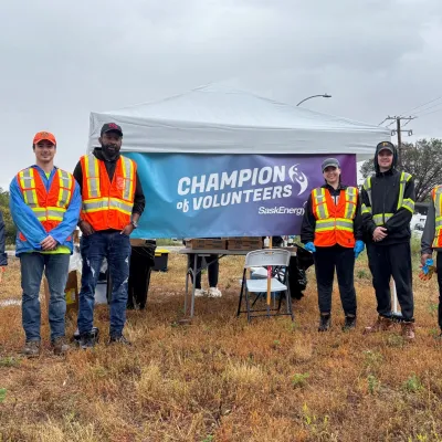 People posing for a photo in high-viz gear
