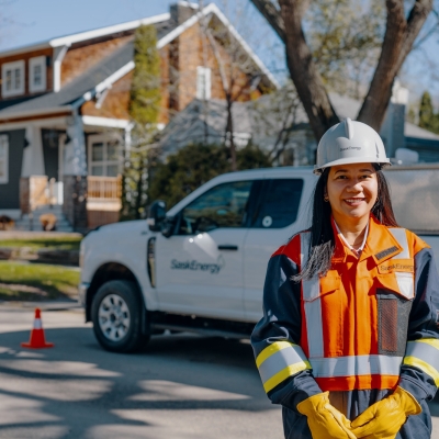 SaskEnergy worker poses in front of SaskEnergy truck