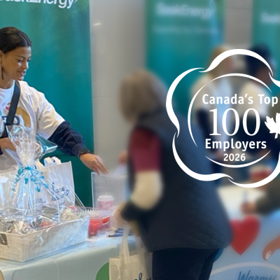 SaskEnergy employee hands out Share the Warmth gift bags.