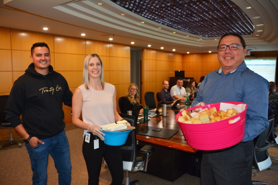 SaskEnergy employees provide bannock to their peers for National Indigenous Peoples Day