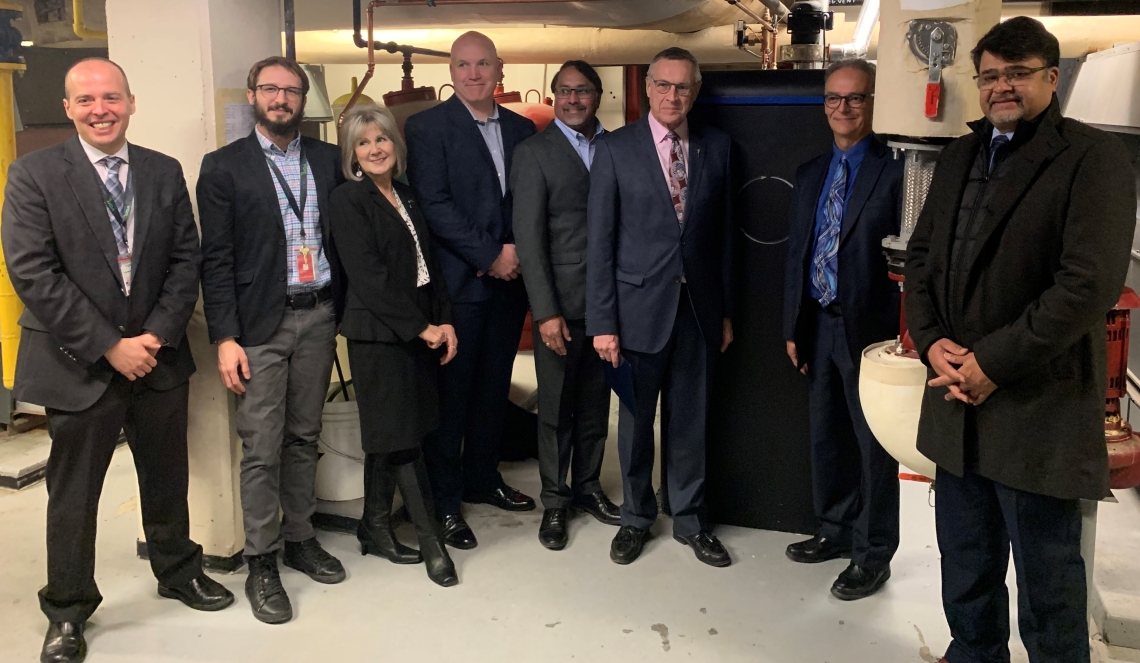 SaskEnergy Acting President and CEO Mark Guillet, Regina Airport Authority CEO James Bogusz, Minister Responsible for SaskEnergy Don Morgan and CleanO2 CEO Jaeson Cardif pose for a photo with the CarbinX unit. 