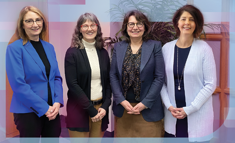 SaskEnergy's four women executives stand together in a row, smiling