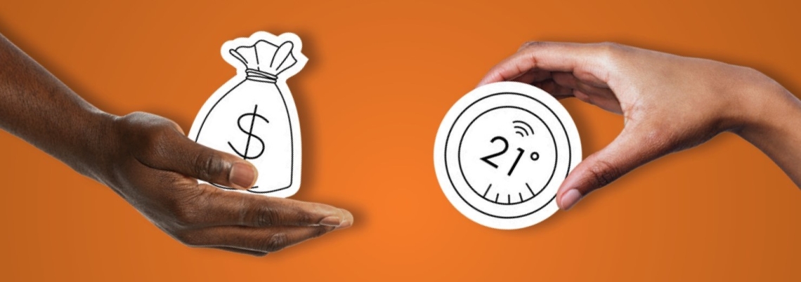 Hands holding a money bag and smart thermostat