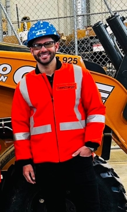 A person in a hard hat and safety vest