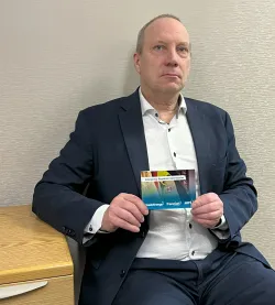 A person with a information booklet