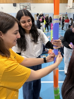 Employees helping students