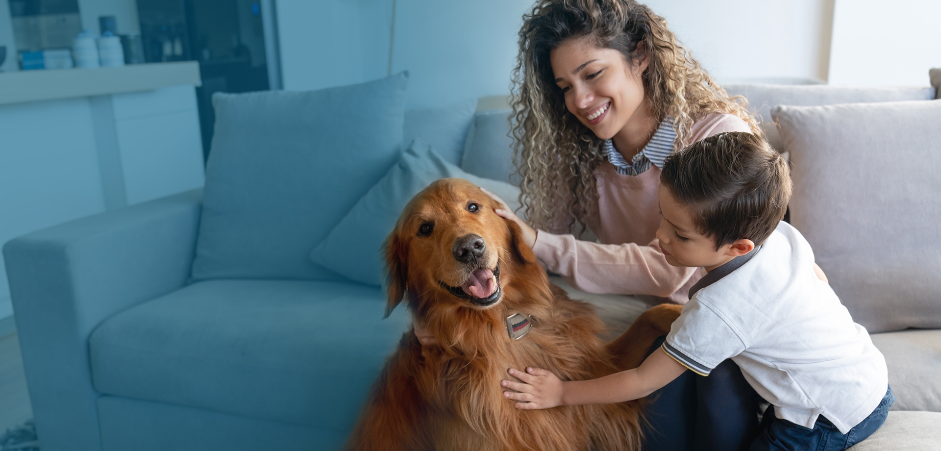 Family on couch with a Dog