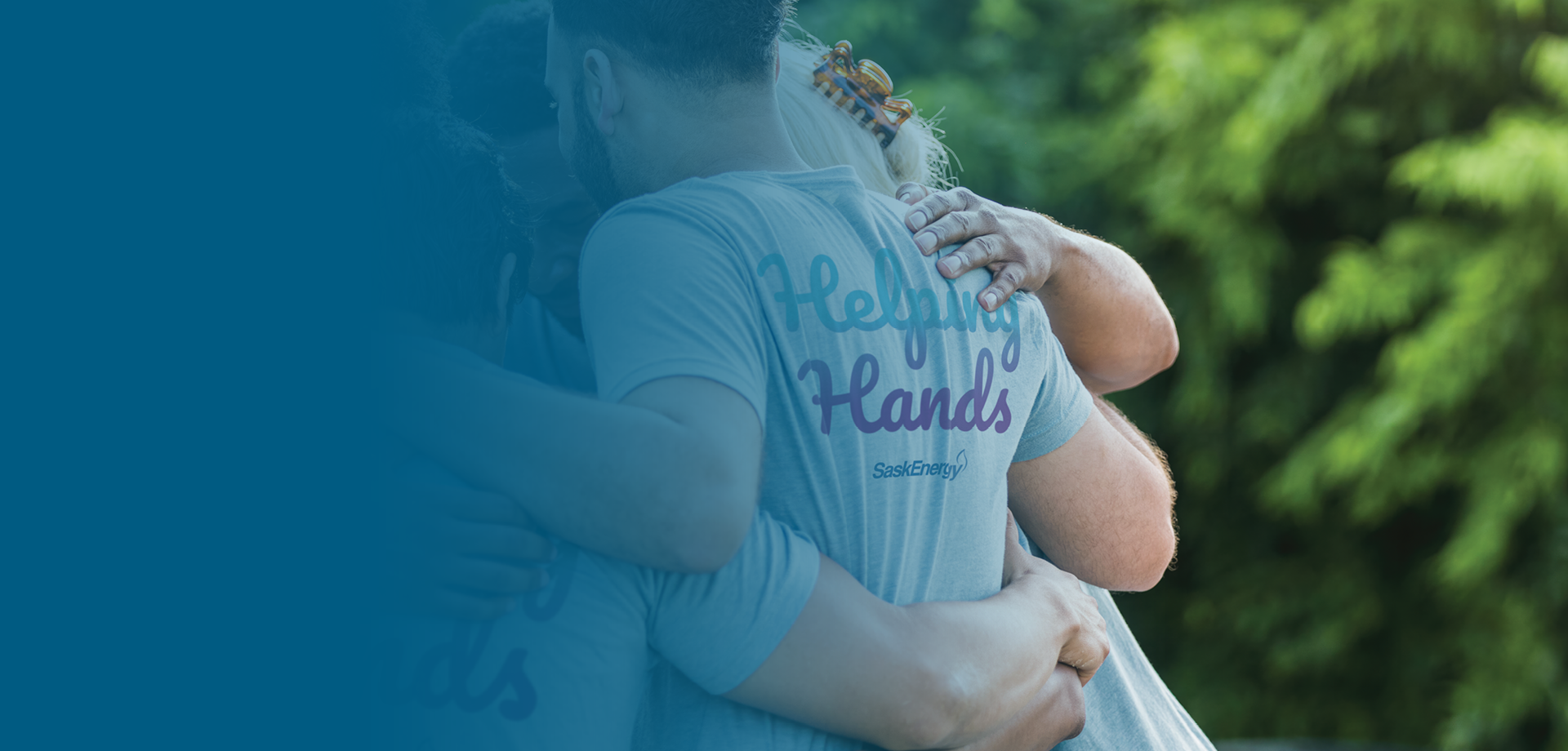 Volunteers wearing helping hands shirt