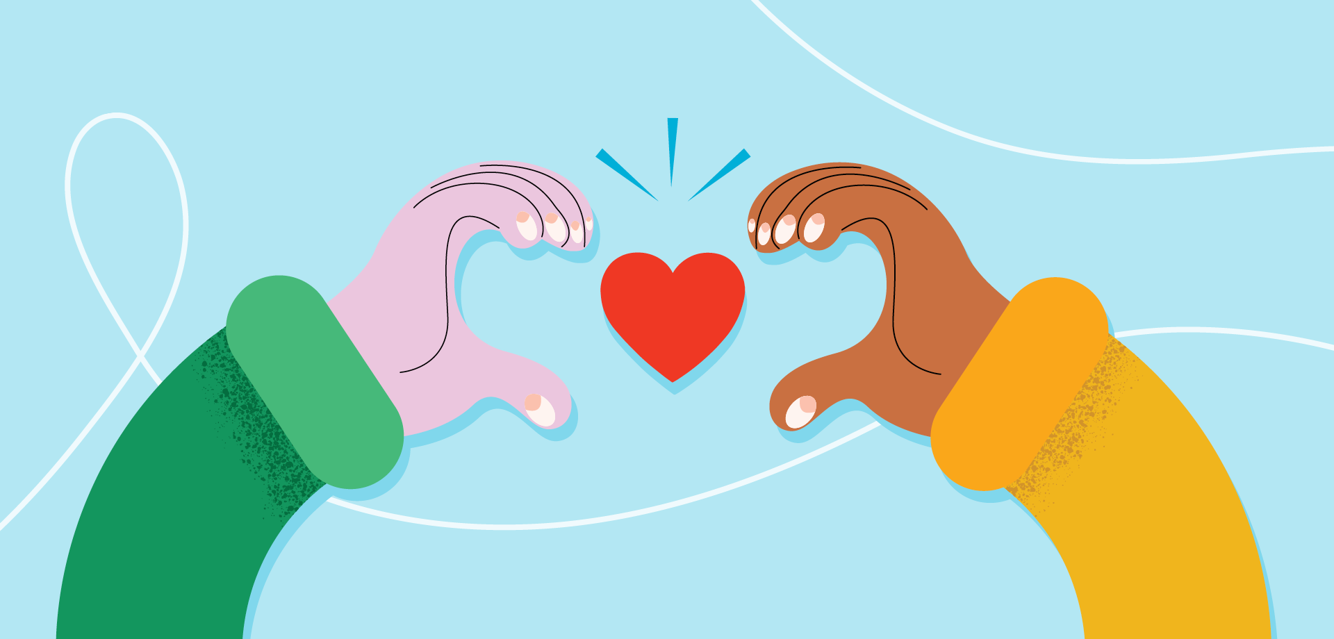 Two arms with sweaters holding a heart