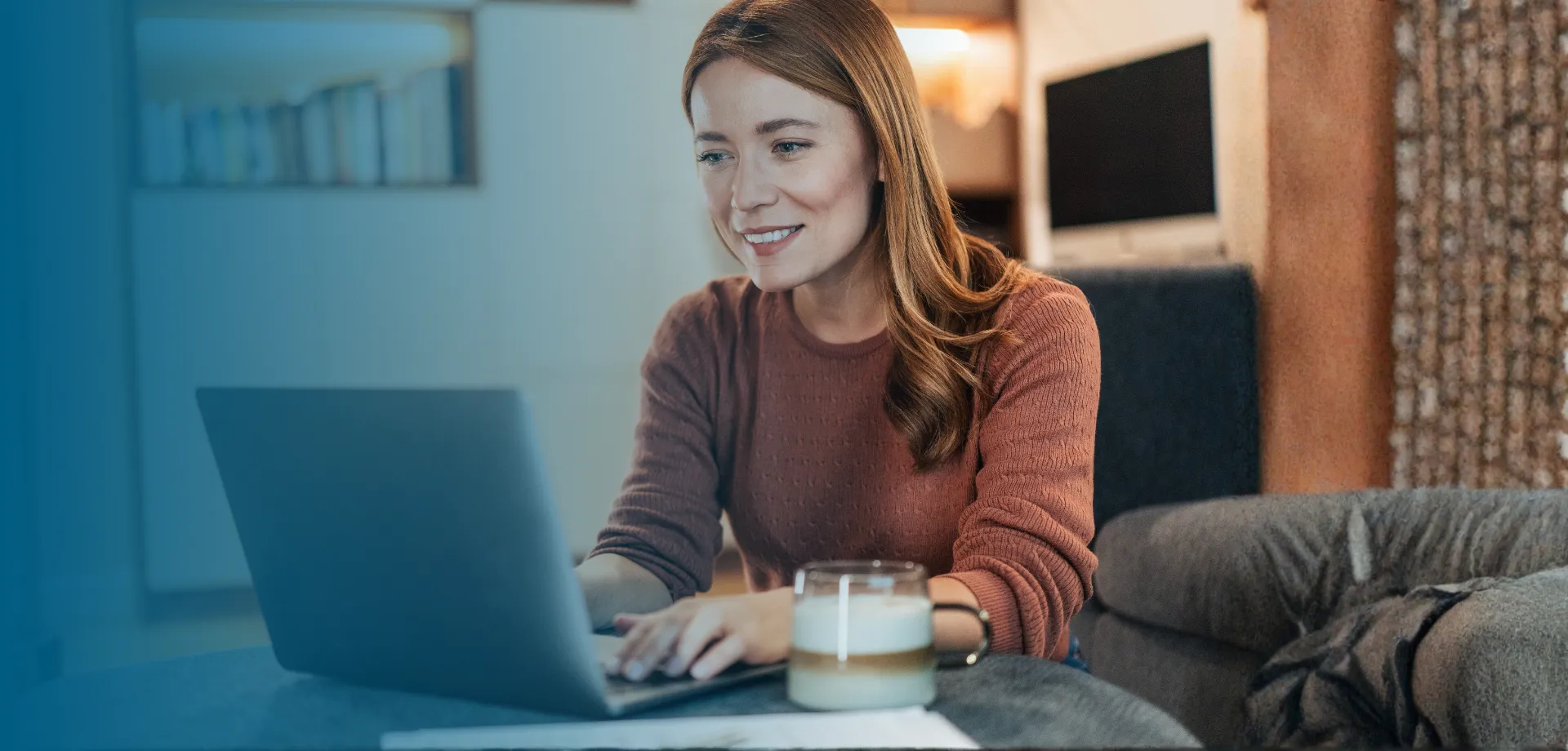 Women on lap top with latte searching for energy saving tips