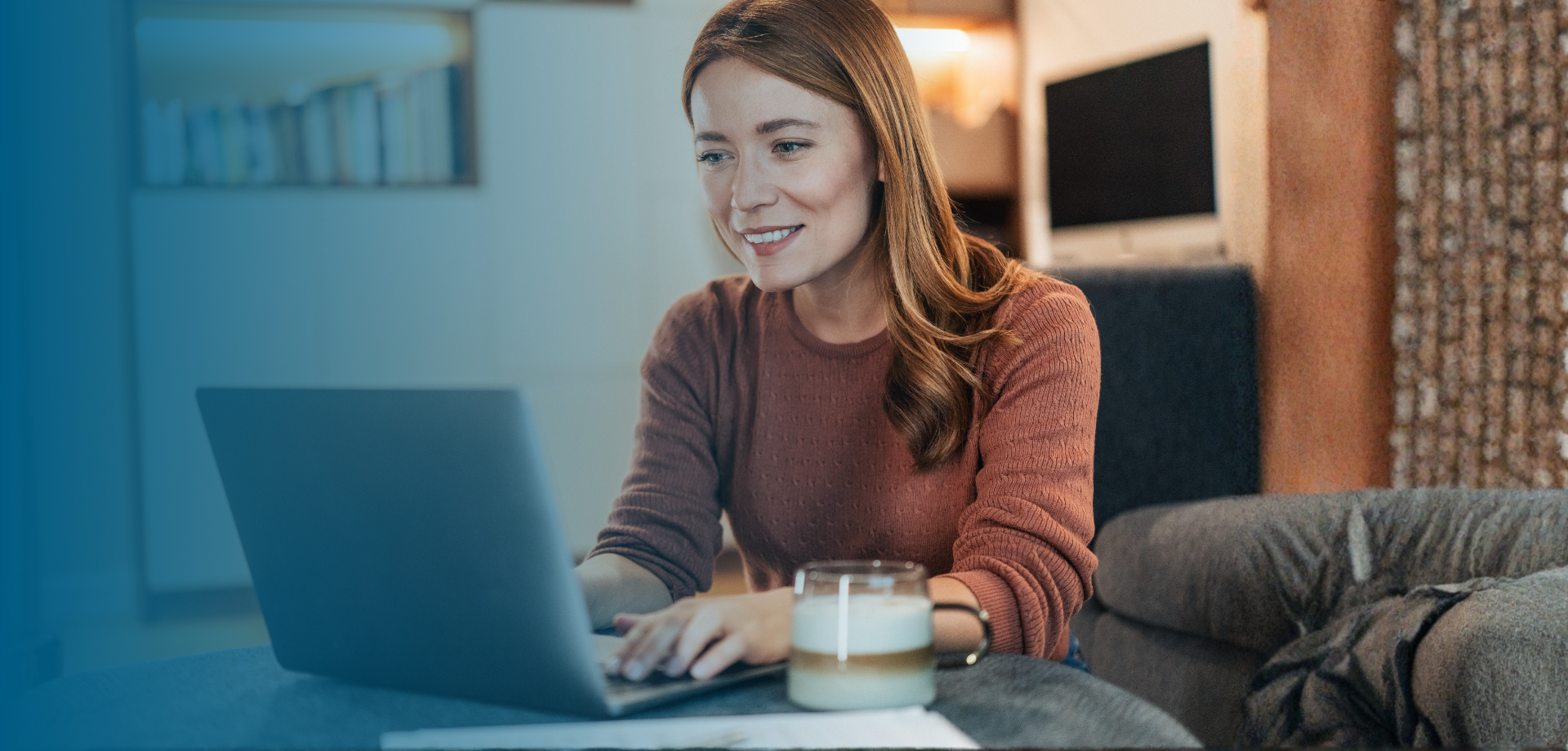 Women on lap top with latte searching for energy saving tips