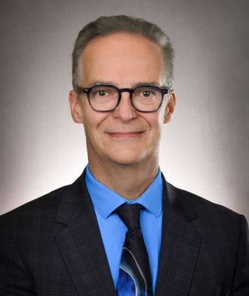 Mark Guillet, K.C. - President and CEO